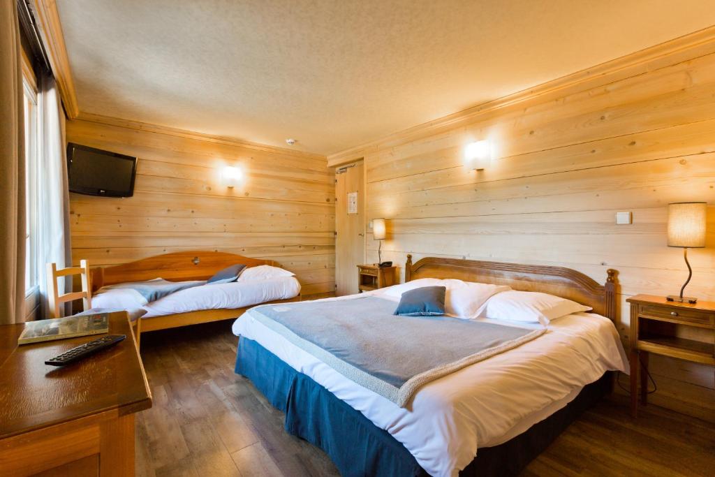 Postel nebo postele na pokoji v ubytování Hôtel La Montagne