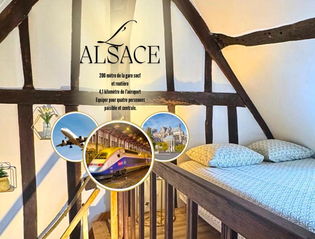 a poster of a train in a room with a bed at Alsace in Beauvais