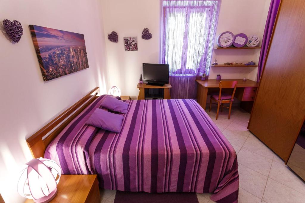 Postel nebo postele na pokoji v ubytování L'Aurora Viola