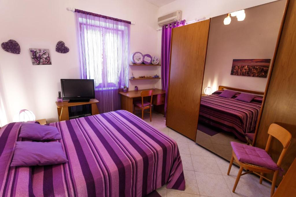 Postel nebo postele na pokoji v ubytování L'Aurora Viola