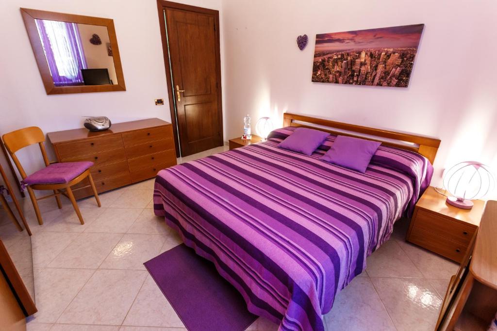 Postel nebo postele na pokoji v ubytování L'Aurora Viola