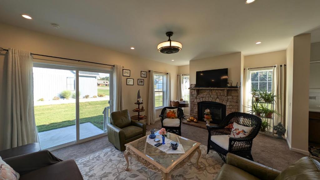 a living room with a couch and a fireplace at Spacious Entire home close to HoliMont and Village in Ellicottville