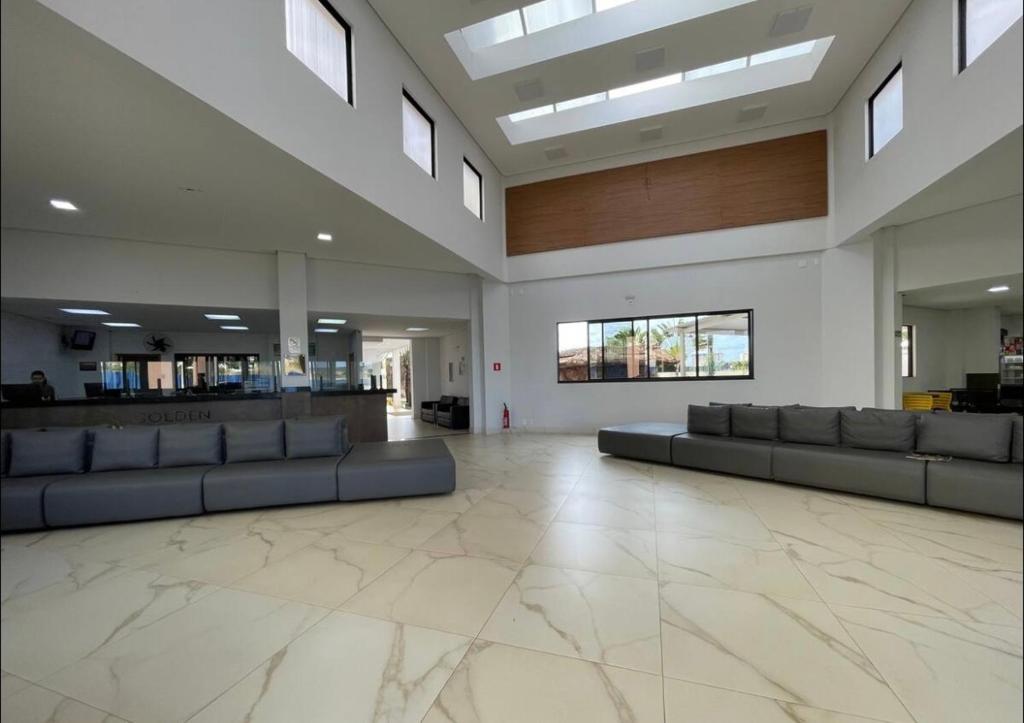 Televiisor ja/või meelelahutuskeskus majutusasutuses Oásis Termal Flat Top Exclusivo Em Caldas Novas