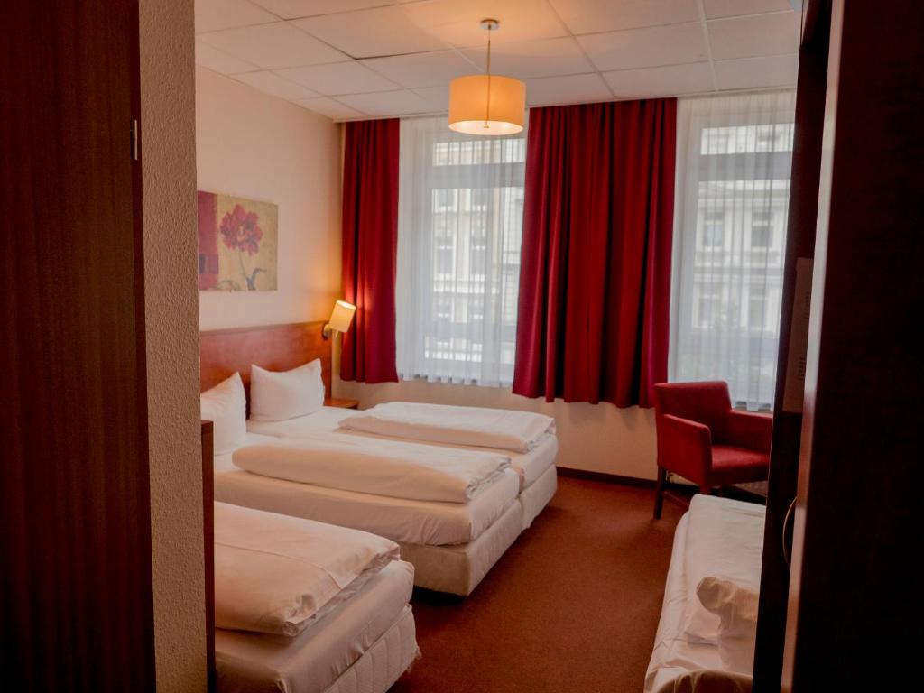Postel nebo postele na pokoji v ubytování Hotel Residence am Hauptbahnhof
