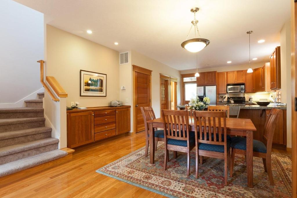 a kitchen and dining room with a table and chairs at Columbia West condo in Hood River