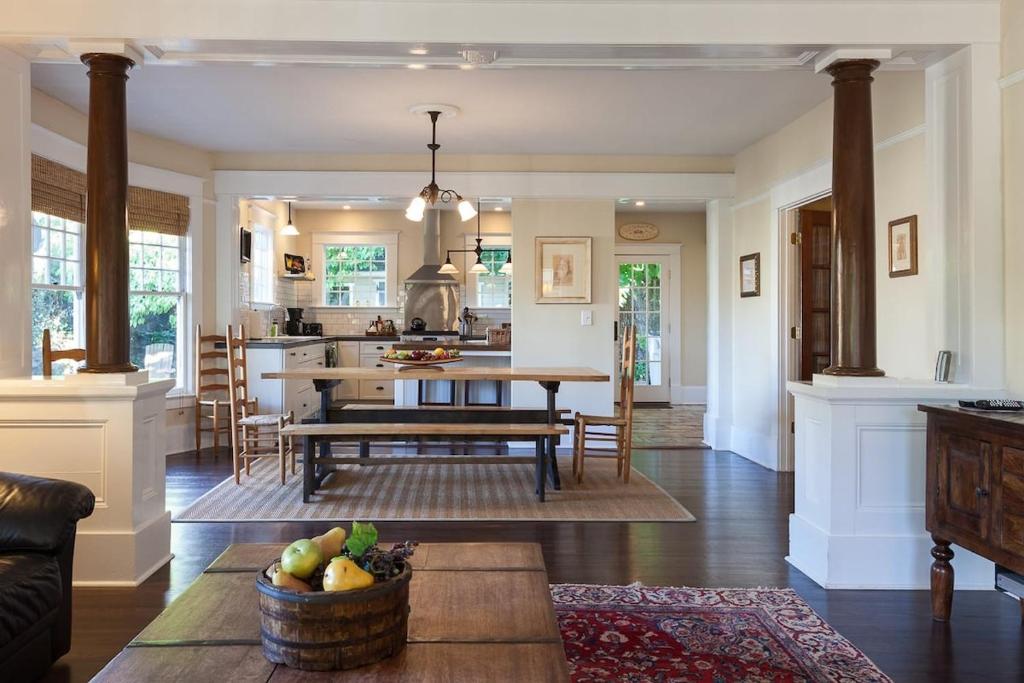 a kitchen and living room with a table and chairs at Cascade Chic home in Hood River