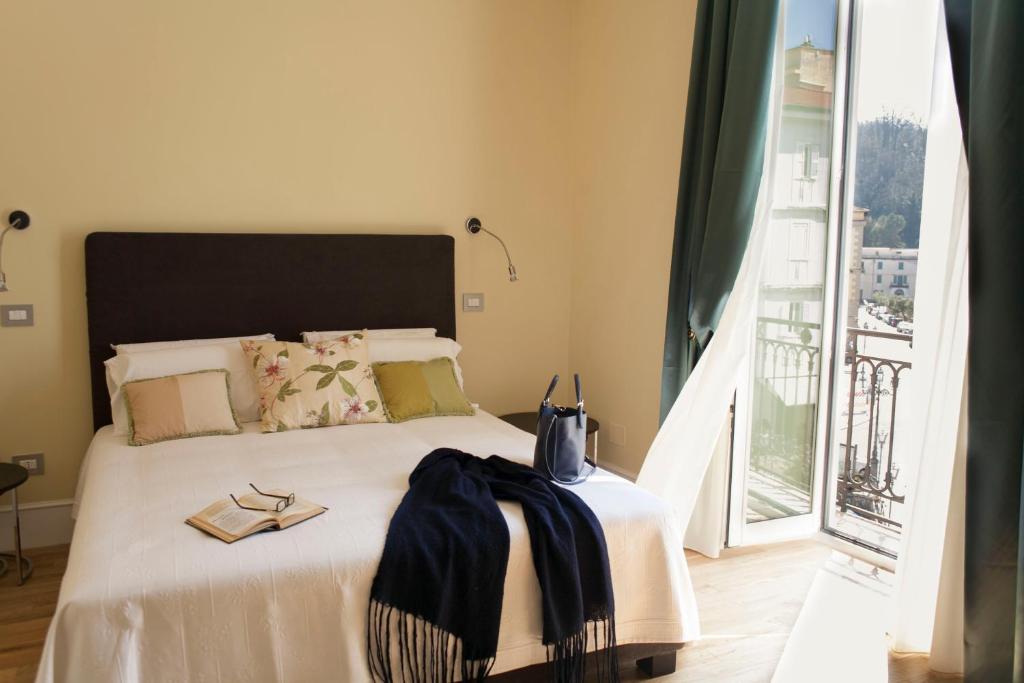Postel nebo postele na pokoji v ubytování Palazzo del Senatore