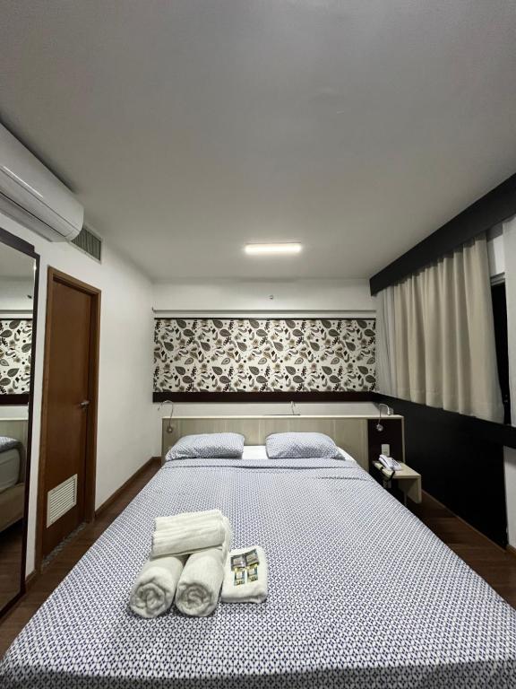 Ένα ή περισσότερα κρεβάτια σε δωμάτιο στο Hotel Mercu Beneficência Bela Vista Com Garagem 1203