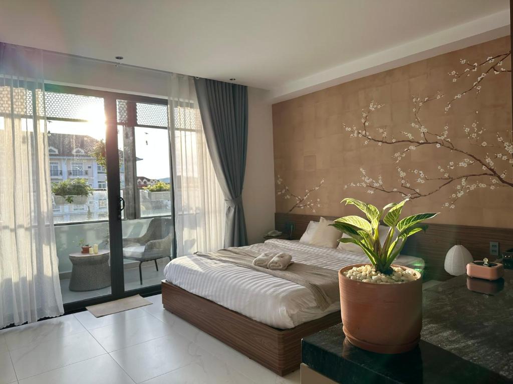 Ένα ή περισσότερα κρεβάτια σε δωμάτιο στο Liora Hotel Dalat