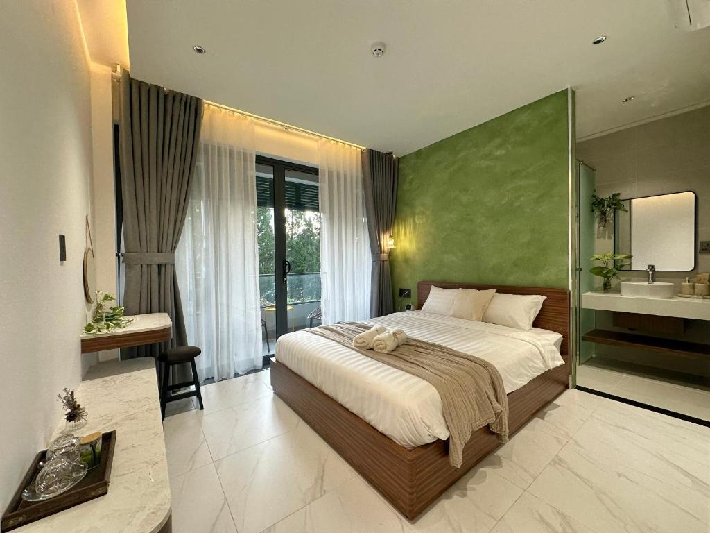 Postel nebo postele na pokoji v ubytování Liora Hotel Dalat