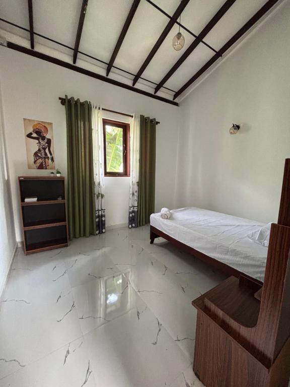 Postel nebo postele na pokoji v ubytování Meows homestay