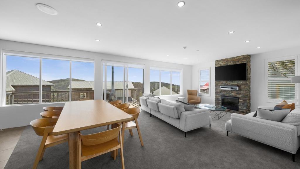 a living room with a couch and a table at Absollut 2 in Mount Hotham