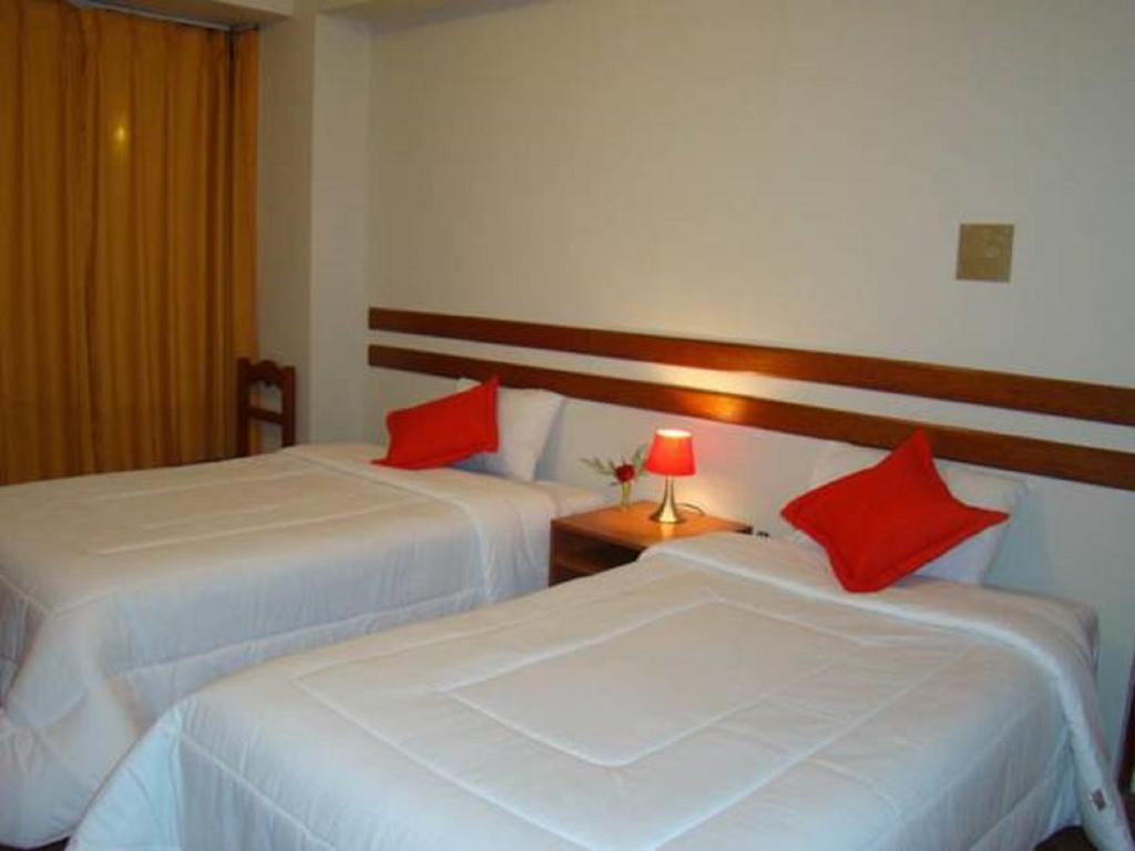 Postel nebo postele na pokoji v ubytování Cusco House
