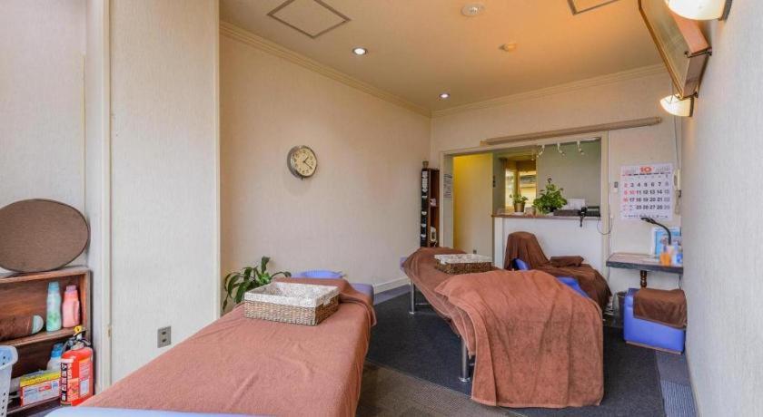 Кровать или кровати в номере Itabashi Hotel Hilltop