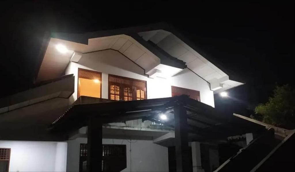 a house at night with lights on it at Angel Haven Villa in Mirissa