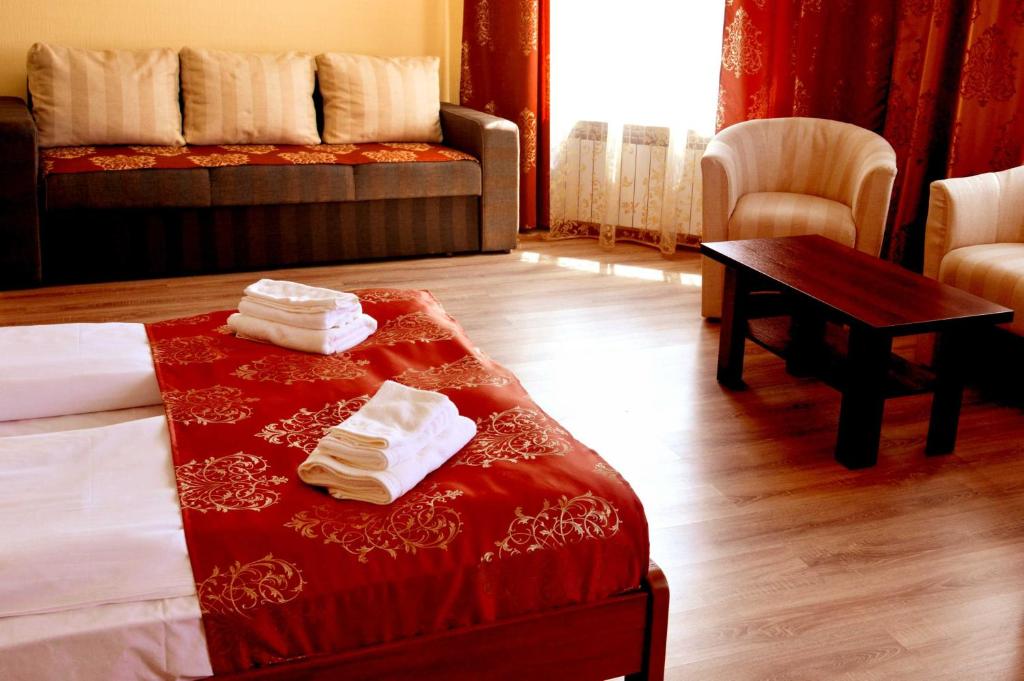Postel nebo postele na pokoji v ubytování Sting Hotel & Event Palace
