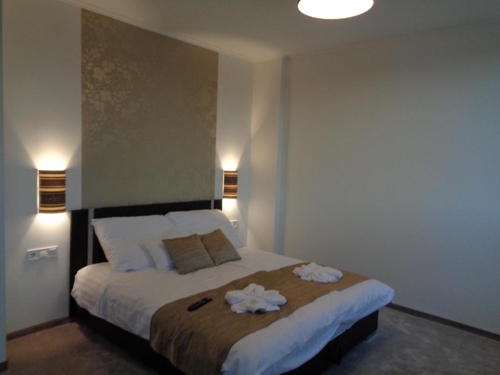 Postel nebo postele na pokoji v ubytování Hotel Írisz
