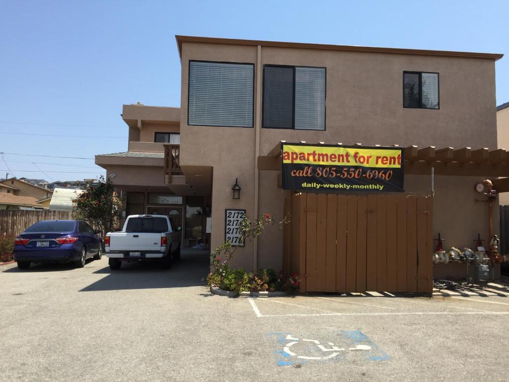 a building with a sign that says elephant for rent and a truck parked in front at 2172-2178 main st in Morro Bay