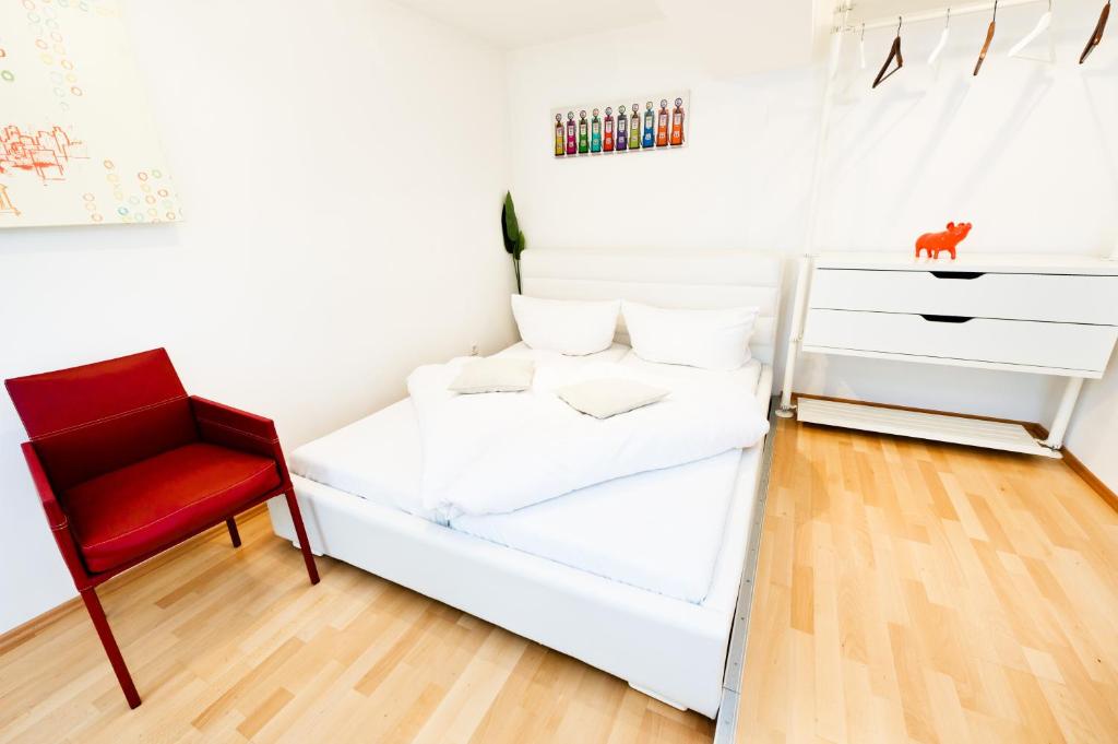 Postel nebo postele na pokoji v ubytování VOX Design Hotel