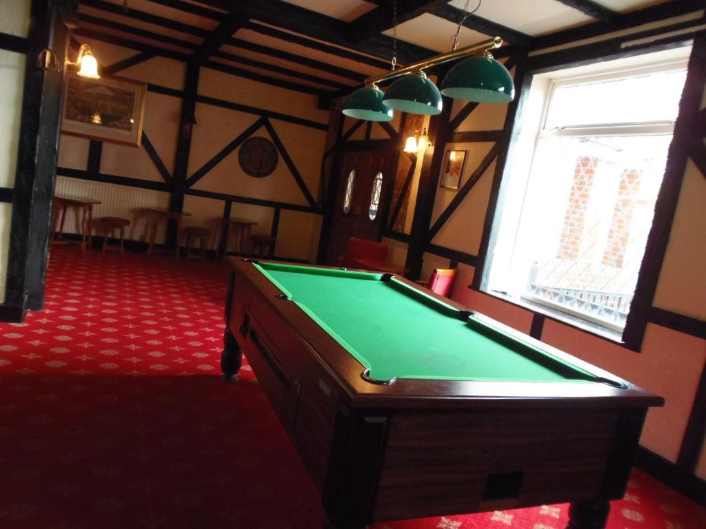 A pool table at Potters International Hotel 