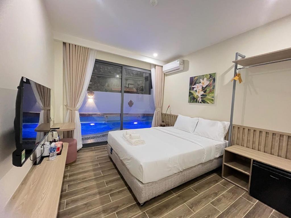 Ένα ή περισσότερα κρεβάτια σε δωμάτιο στο Chăm Charm Mũi Né, Phan Thiết