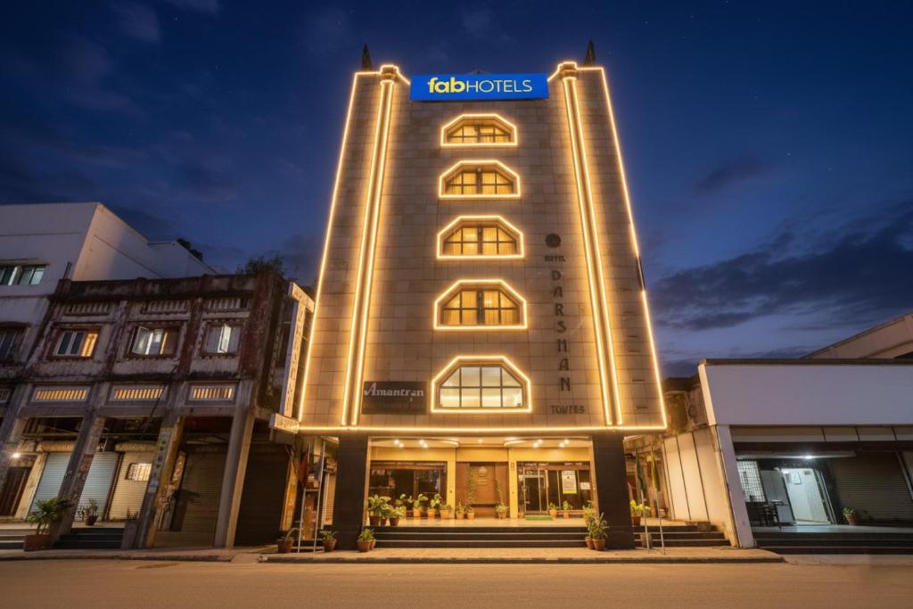 a building with a sign on the side of it at FabHotel Darshan Tower in Nagpur