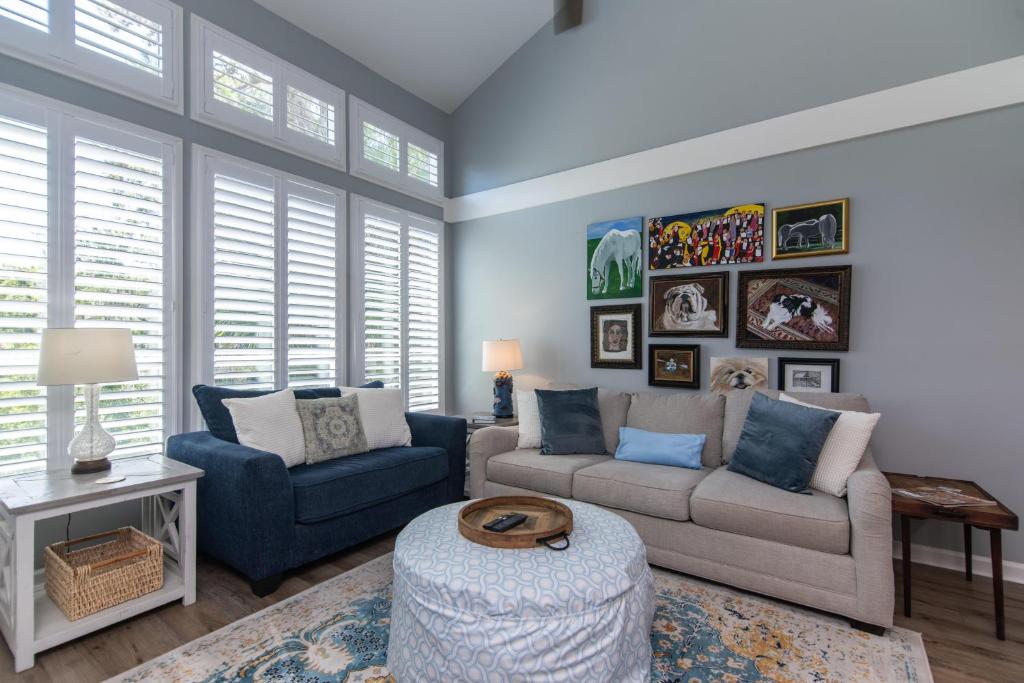a living room with a couch and chairs and a table at 478 Egrets Pointe in Edisto Island