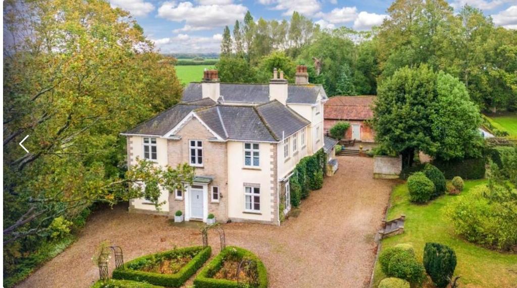 an aerial view of a large white house at Hacheston Lodge in Marlesford