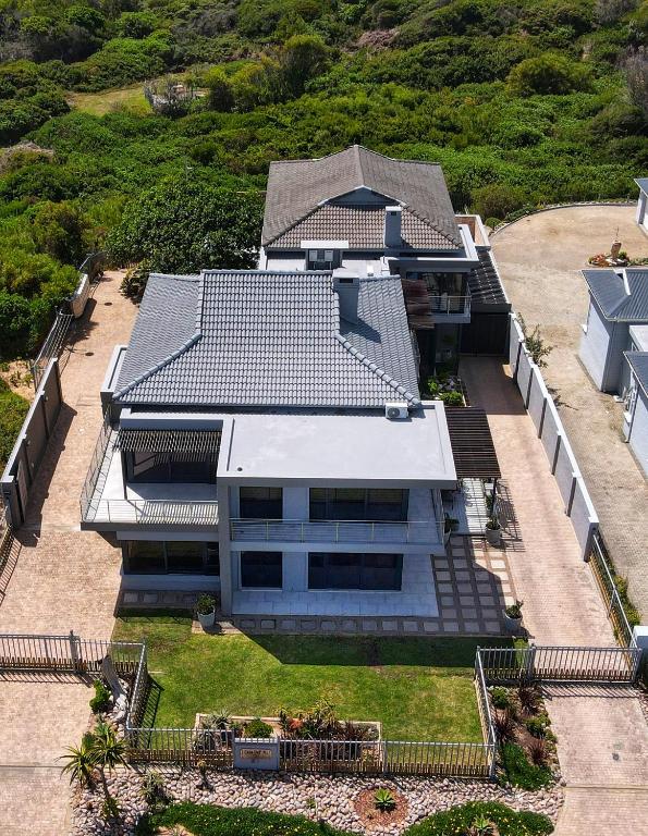 an aerial view of a house with a roof at Casa Del Mi, Sedgefield in Sedgefield