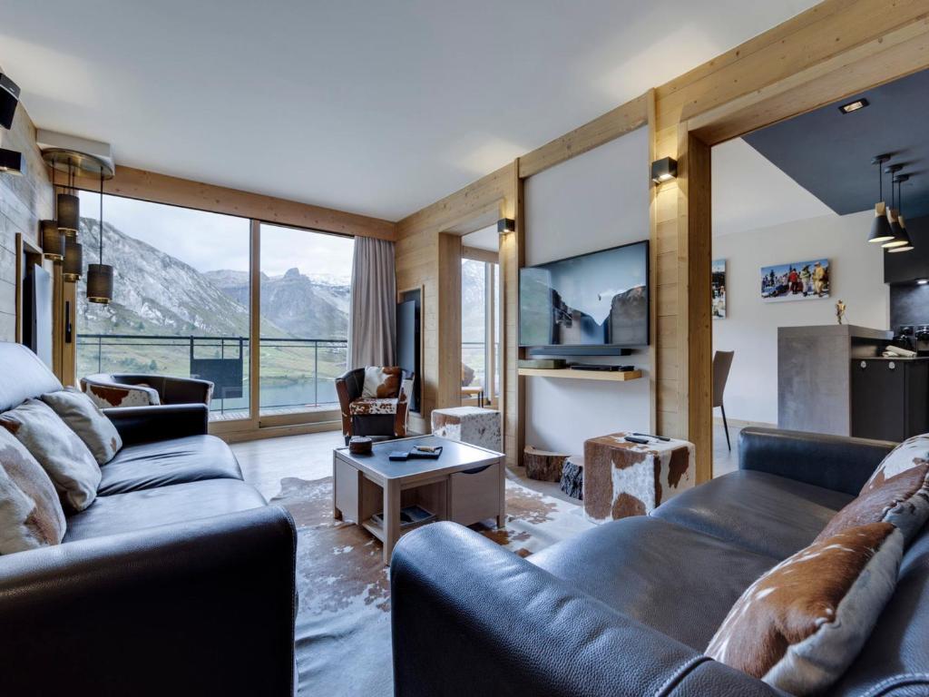 a living room with a couch and a table at Tignes le Lac - Grand Apt 5 Pièces, 8-10 Pers, Wifi, Proche Commerces et Remontées - FR-1-641-81 in Tignes