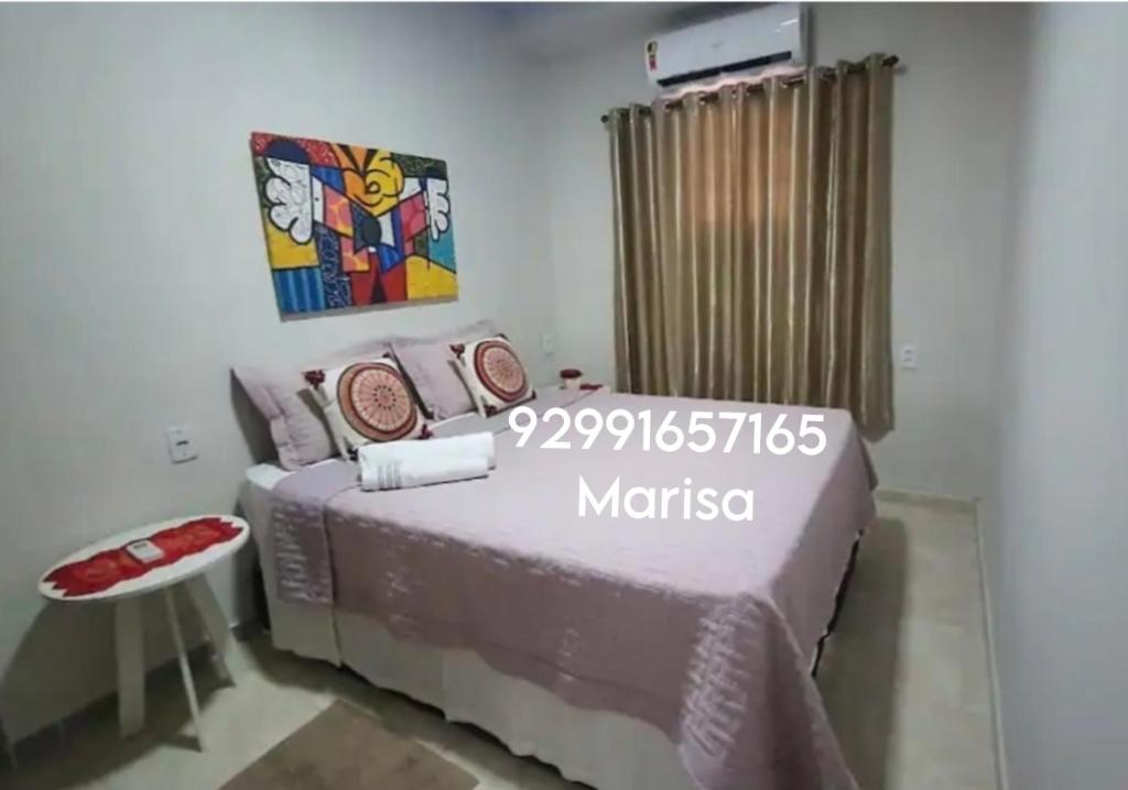 a bedroom with a bed in a room at Apto 2 - Hospedagem da Almira in Manaus