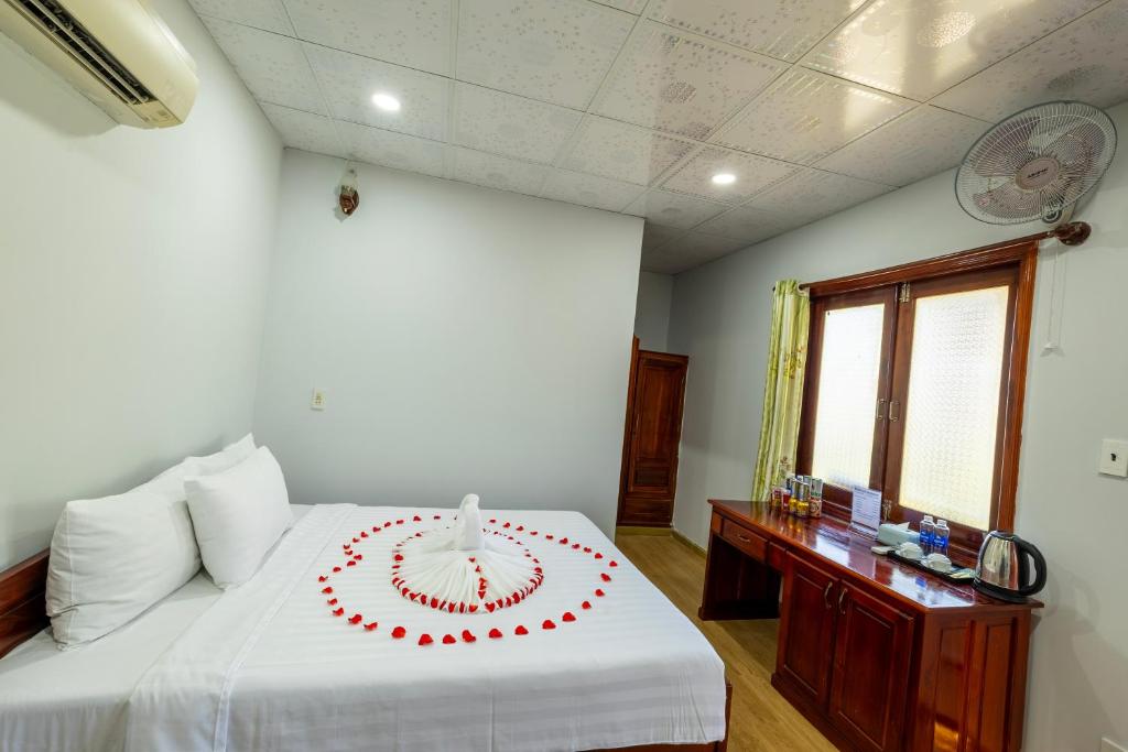 Ένα ή περισσότερα κρεβάτια σε δωμάτιο στο Minh Vuong Bungalow