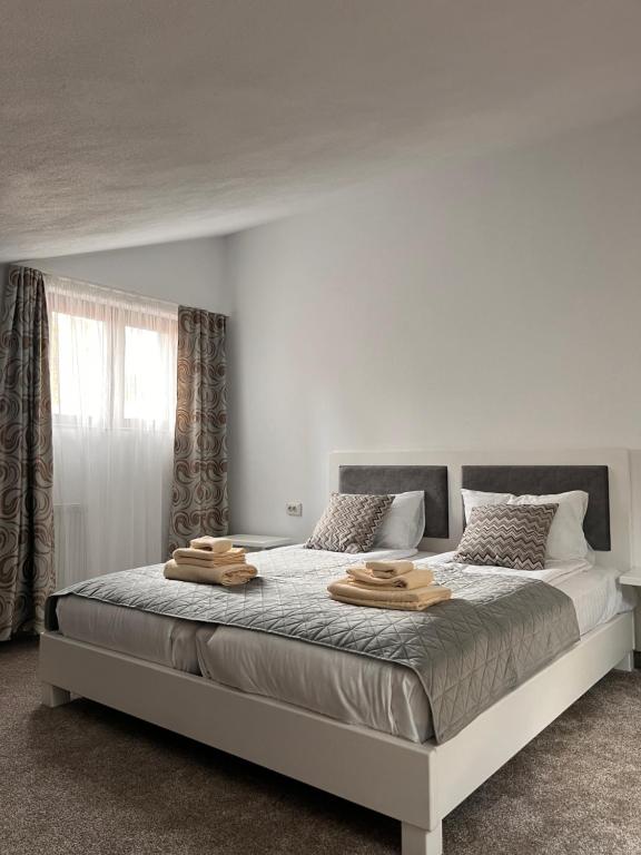 a bedroom with a bed with two wooden blocks on it at Lili's in Anina
