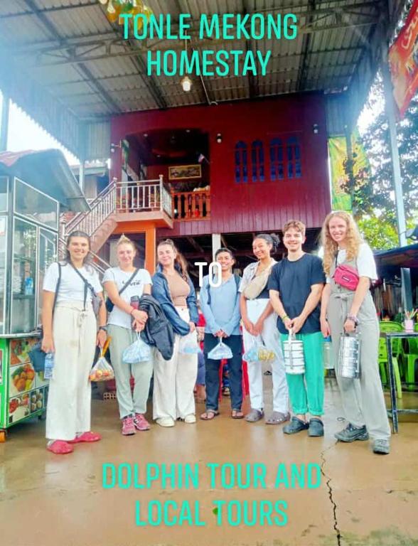 a group of women standing in front of a store at Tonle Mekong Homestay in Krong Kracheh