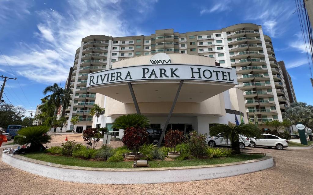 a hotel with a sign that reads nivea park hotel at Privé Riviera Park Apt 730 in Caldas Novas