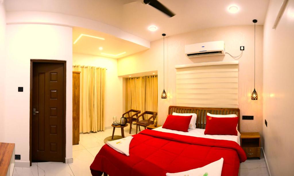 Postel nebo postele na pokoji v ubytování Hotel Elroi Suites