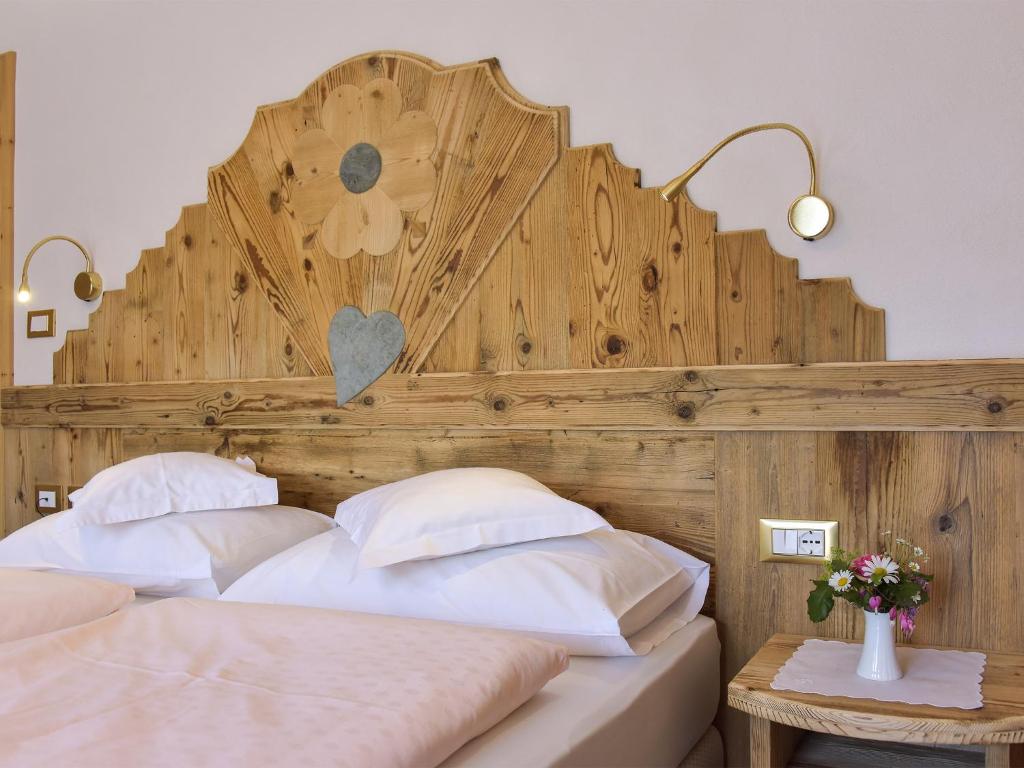 Postel nebo postele na pokoji v ubytování Hotel Cesa Padon