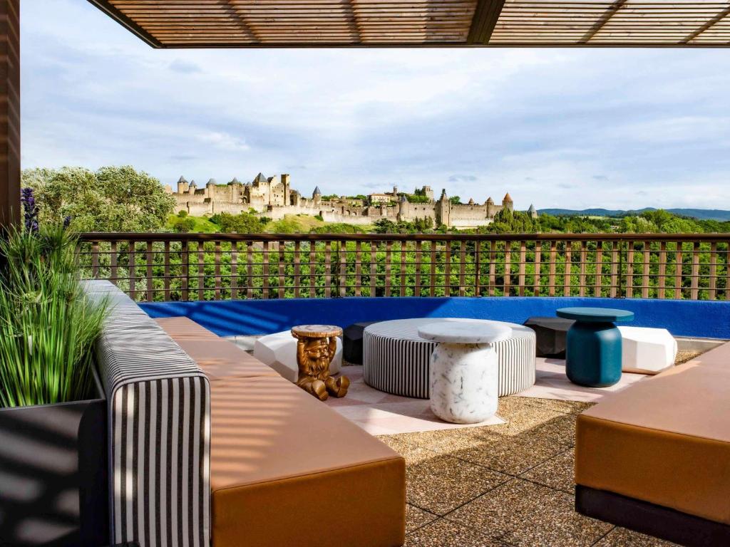 a patio with a view of a castle at Tribe Carcassonne in Carcassonne