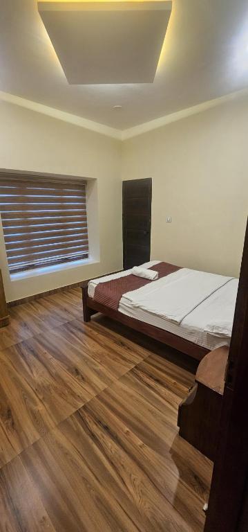 Postel nebo postele na pokoji v ubytování Romanzia Village Homestay