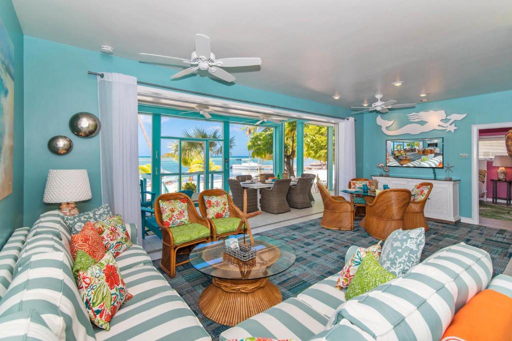 a living room with a couch and chairs at Bit of Heaven in Driftwood Village
