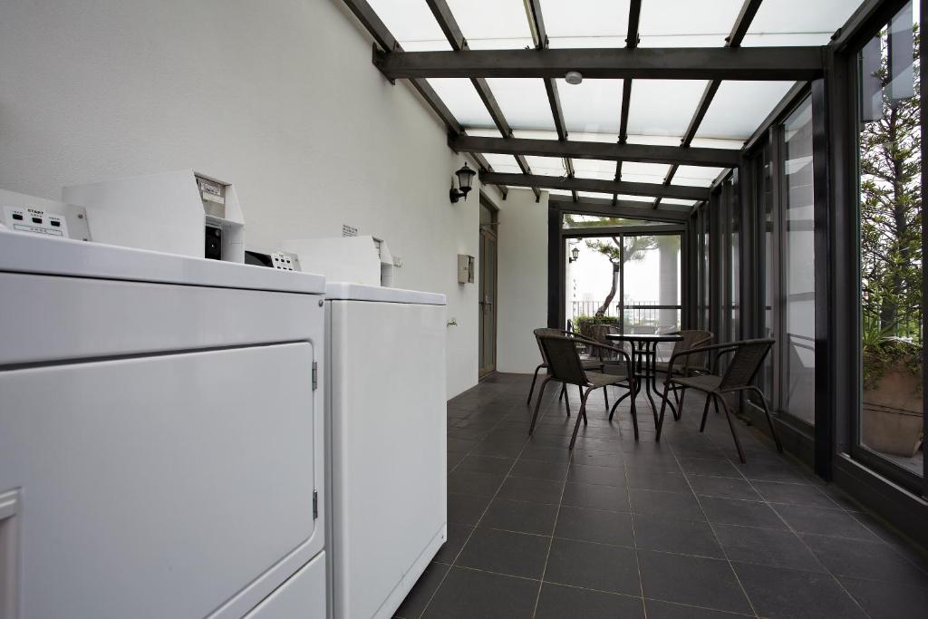 Kuchyň nebo kuchyňský kout v ubytování Micasa Hotel