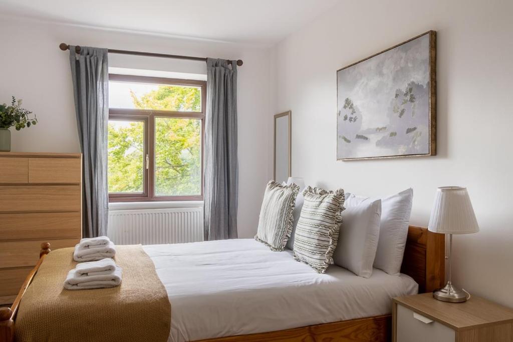 Ένα ή περισσότερα κρεβάτια σε δωμάτιο στο GuestReady - Quaint Haven in Dublin