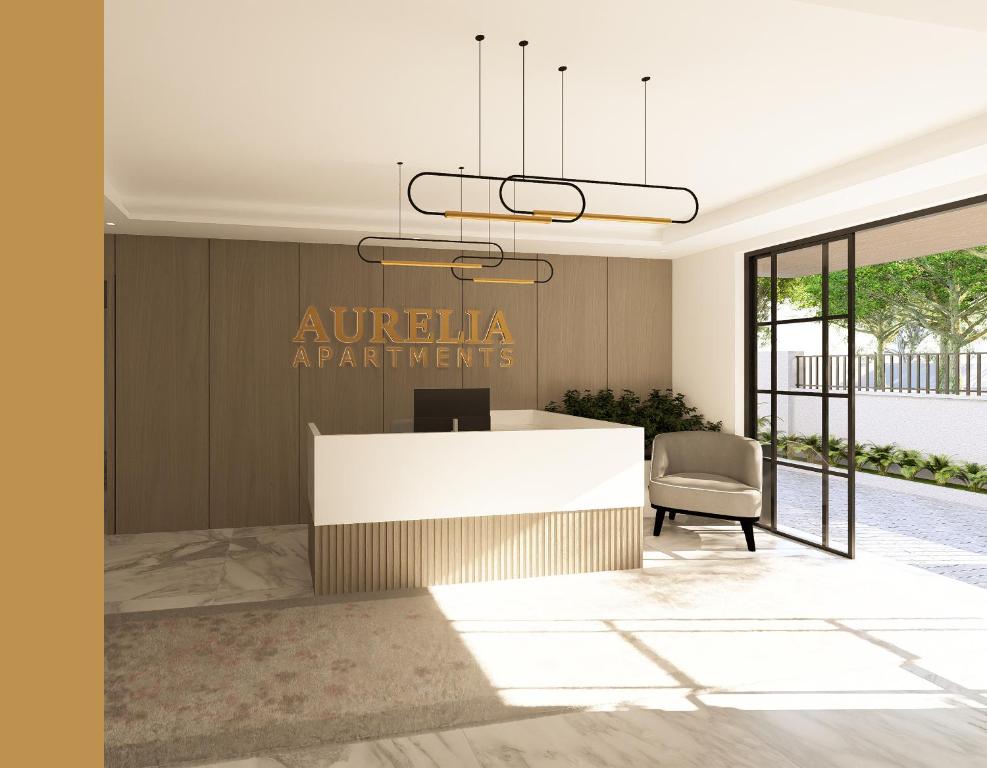 an office lobby with a reception desk and a chair at Aurelia Apartments in Mama