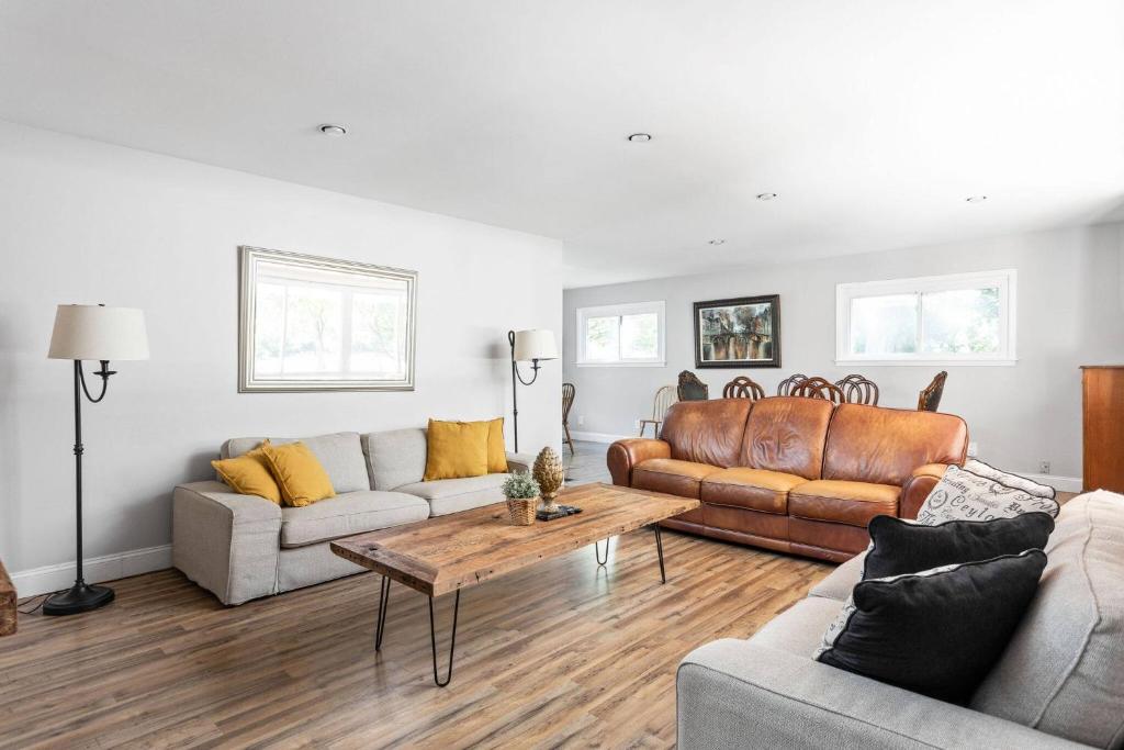 a living room with two couches and a coffee table at 4Bedroom 2 Bath Home in Arts District-Smoky Row A in Carmel