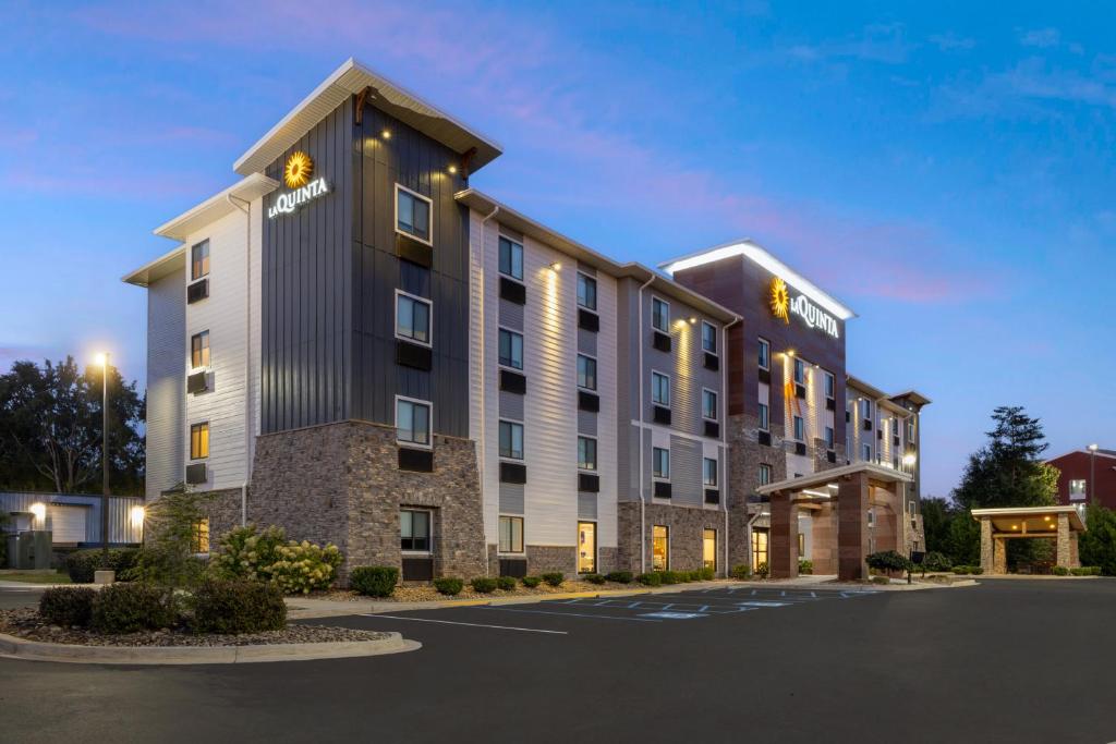 a rendering of a hotel in a parking lot at La Quinta Inn & Suites by Wyndham Greenville Woodruff Rd in Greenville