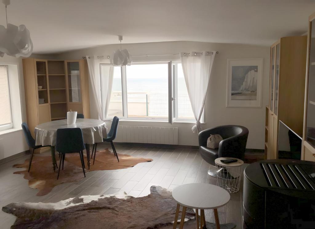 Zona de estar de Logement Face Mer