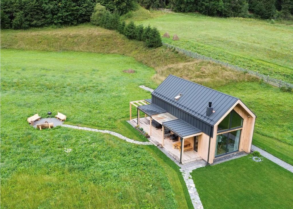 an overhead view of a tiny house in a field at Vama Chalet in Vama Buzăului