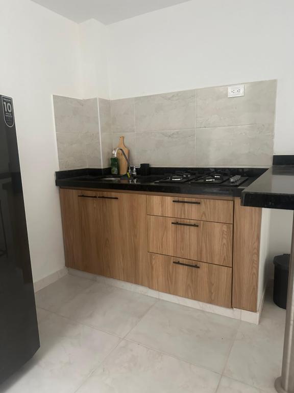 a kitchen with a sink and a counter top at Apartamento Playa Real - San Gil in San Gil