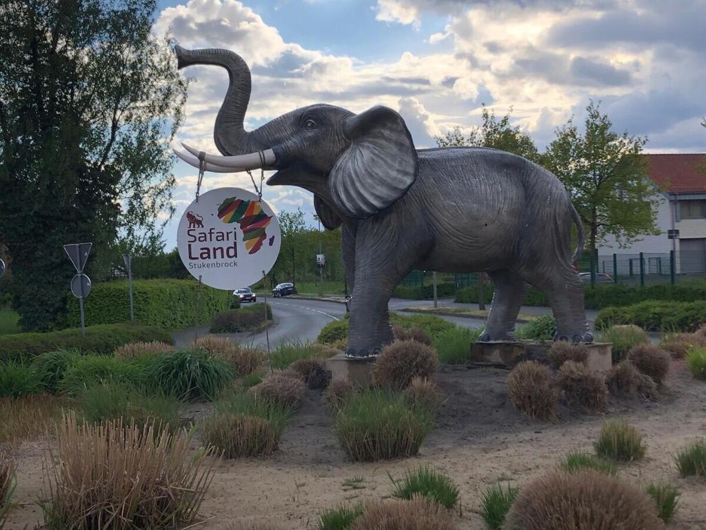 a statue of an elephant standing next to a road at Ferienwohnung bei Wessels in Schloß Holte-Stukenbrock