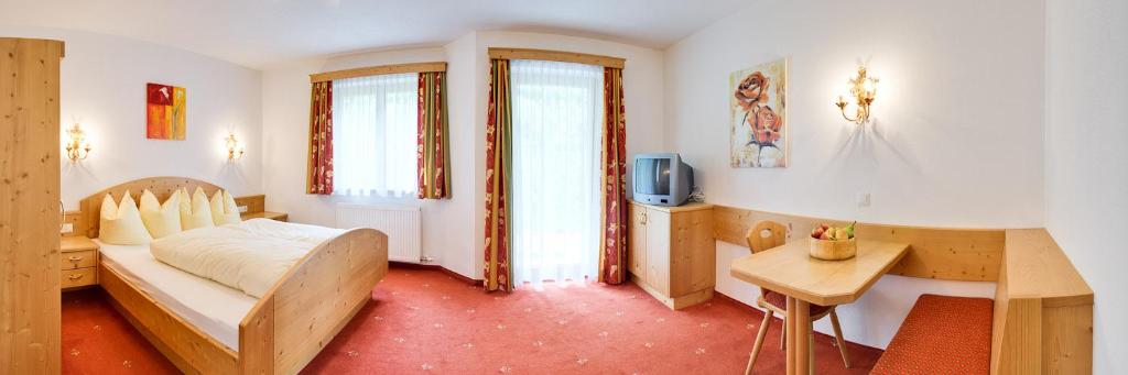 Postel nebo postele na pokoji v ubytování Appartements Michaela